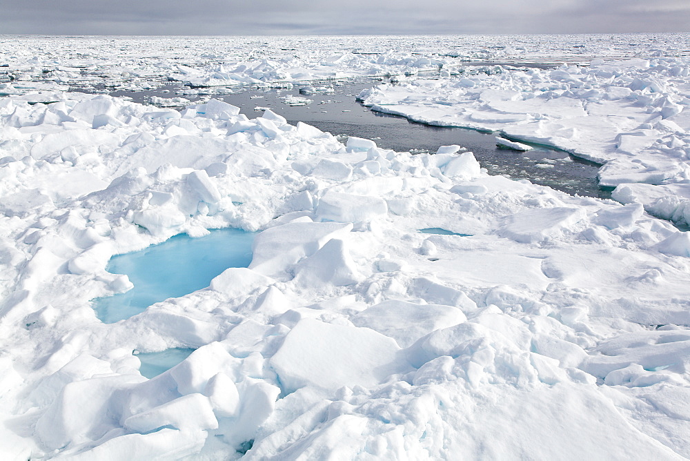 Open leads surrounded by multi-year ice floes in the Barents Sea between EdgeØya (Edge Island) and Kong Karls Land in the Svalbard Archipelago, Norway.