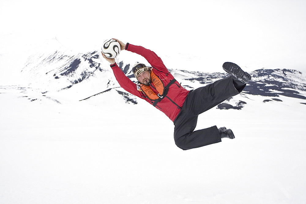 Head chef Tommi of the Lindblad Expedition ship National Geographic Endeavour at  play in Antarctica. No model release.