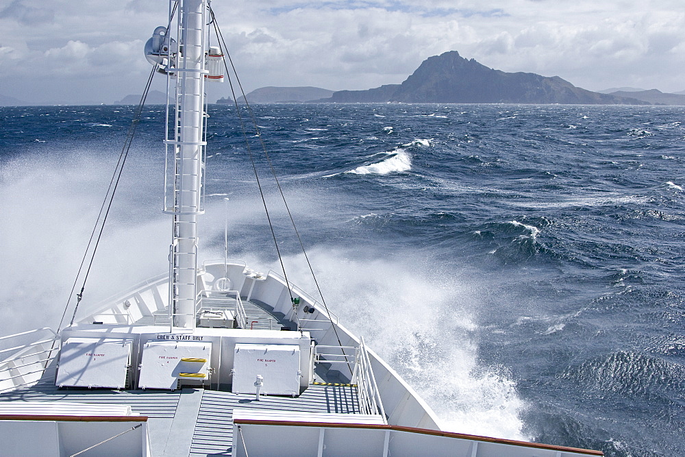 The Lindblad expedition ship National Geographic Endeavour rounding Cape Horn off the tip of Tierra del Fuego, Chile in the Drake Passage between South America and the Antarctic peninsula.