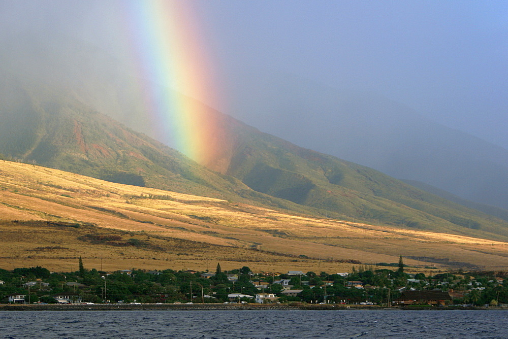 Rainbow after a rain shower over the West Maui Mountains, Maui, Hawaii, USA.