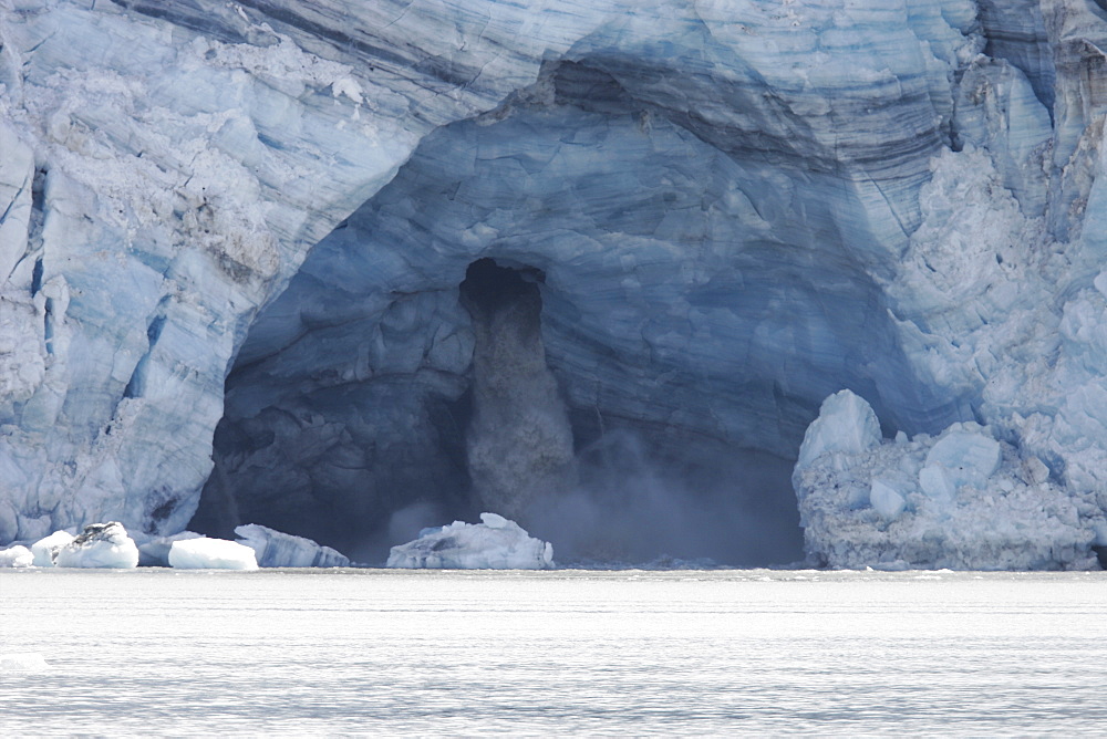 Lamplugh Glacier showing meltwater cave, Glacier Bay National Park, southeast Alaska, USA.