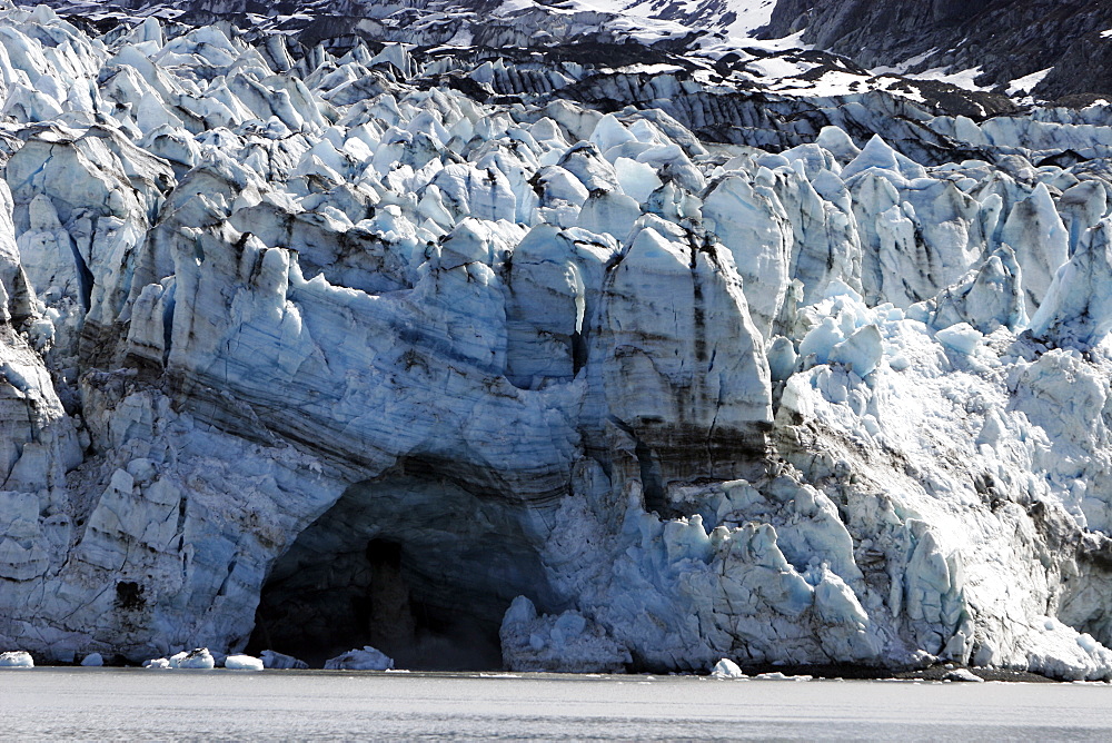 Lamplugh Glacier showing meltwater cave, Glacier Bay National Park, southeast Alaska, USA.