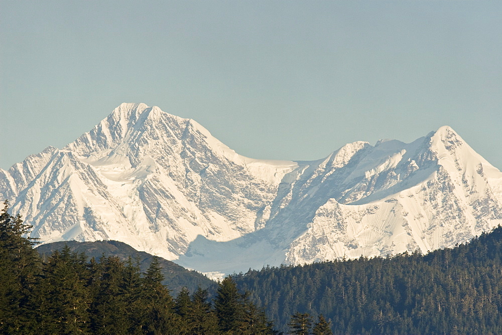 A view of the Fairweather mountain range at sunrise near Inian Pass, Southeast Alaska, USA. Pacific Ocean.