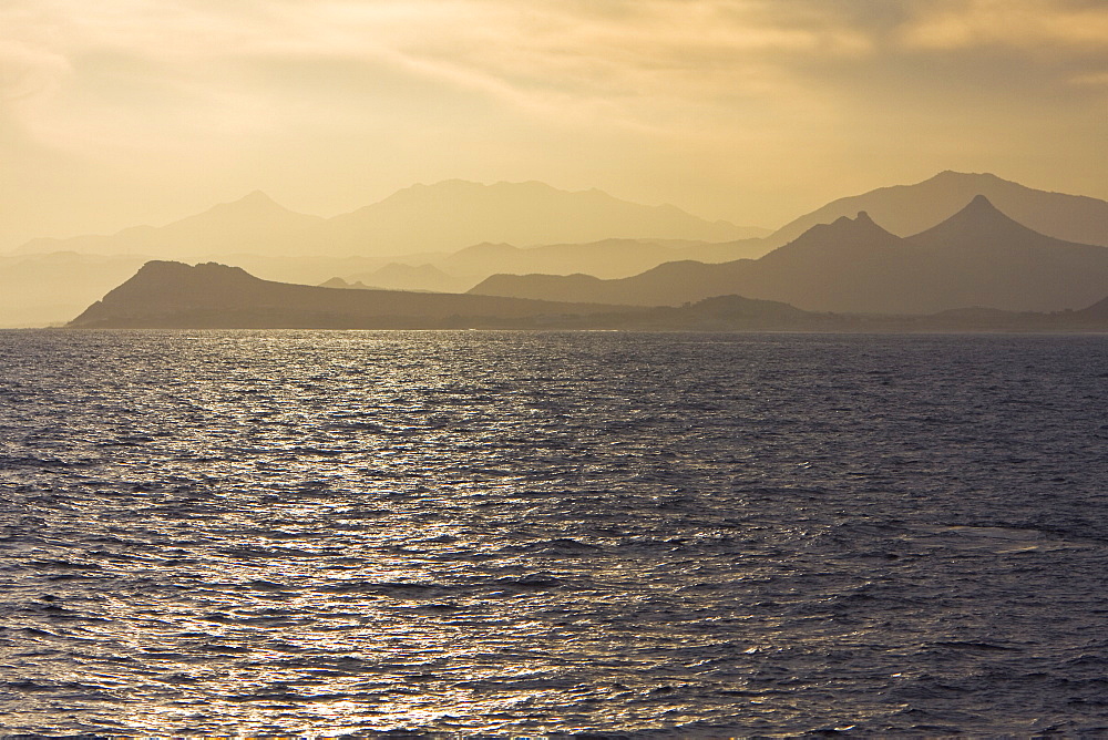 Sunset over the southern Baja Peninsula in Baja California Sur, Mexico. This photo is taken from a boat on the Gulf of California (Sea of Cortez) side of the peninsula.