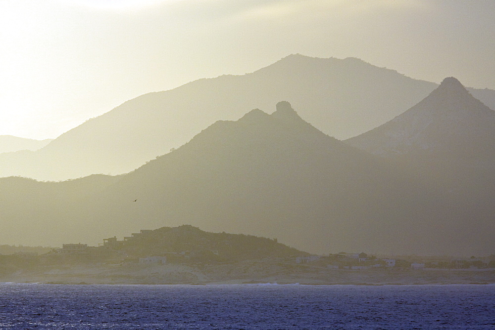 Sunset over the southern Baja Peninsula in Baja California Sur, Mexico. This photo is taken from a boat on the Gulf of California (Sea of Cortez) side of the peninsula.