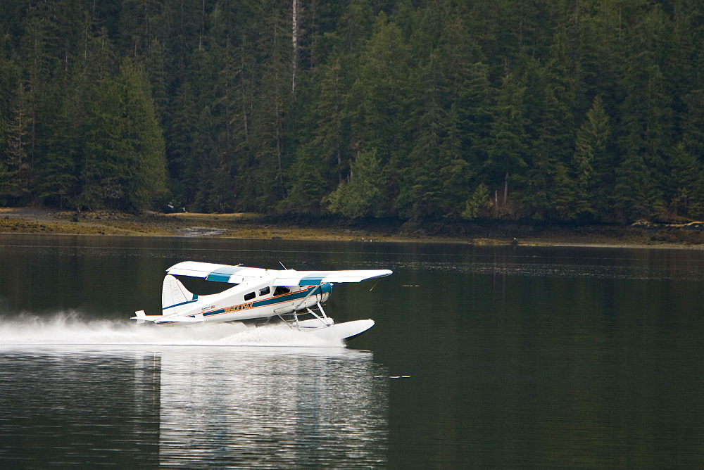 Float Planes operating in southeast Alaska, USA, Pacific Ocean. The float plane is one of the most common ways to travel in the calm waters of the inside passage and throughout Alaska.