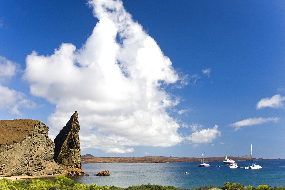 Anchored tour boats at Bartolome off Santiago Island in the Galapagos Island Archipeligo, Ecuador. Pacific Ocean.