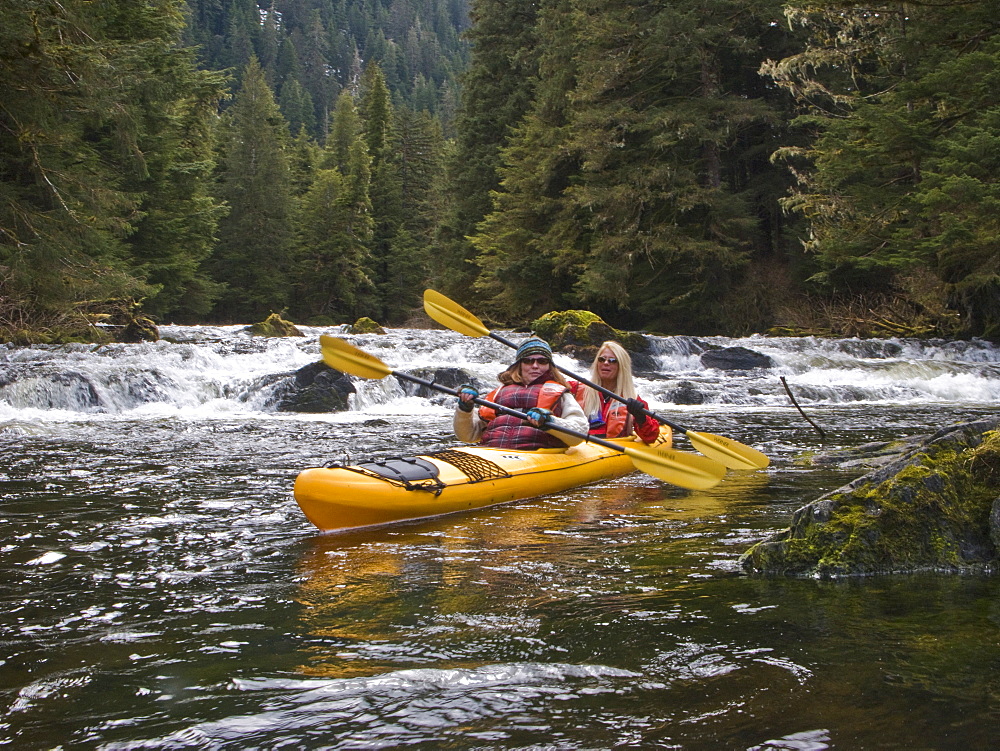 Lindblad Expedition guests and staff from the National Geographic Sea Lion kayaking in Southeast Alaska, USA in the late spring.