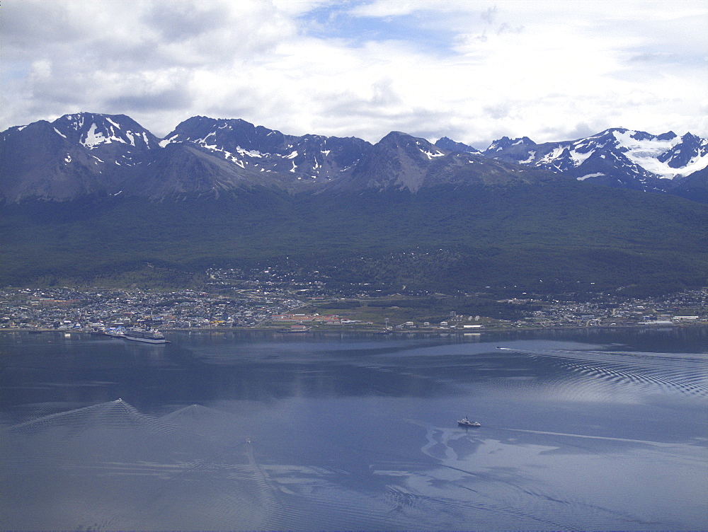 Aerial views of snow-capped mountains, ice fields, and glaciers on a charter flight from Santiago, Chile to Ushuaia, Argentina