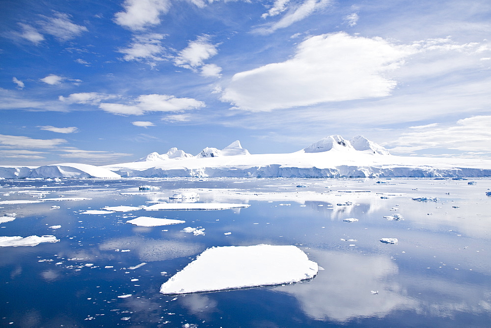 The Lindblad Expeditions ship National Geographic Explorer pushes through ice in Crystal Sound, south of the Antarctic Circle