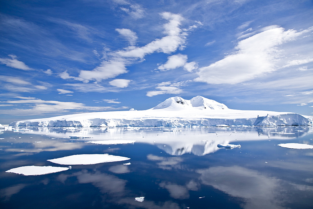 The Lindblad Expeditions ship National Geographic Explorer pushes through ice in Crystal Sound, south of the Antarctic Circle