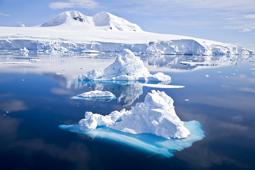 The Lindblad Expeditions ship National Geographic Explorer pushes through ice in Crystal Sound, south of the Antarctic Circle