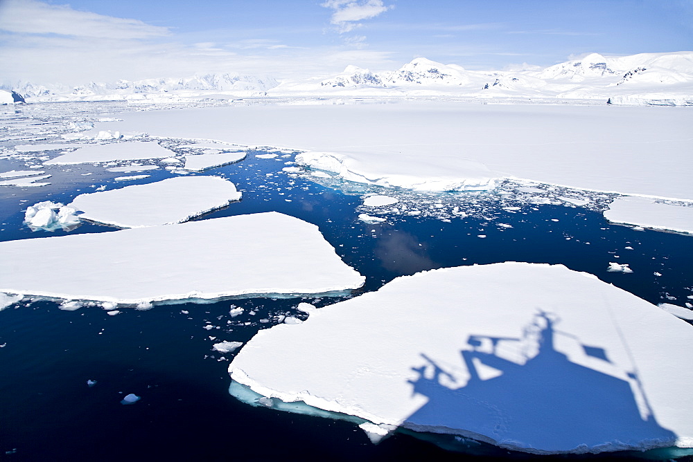 The Lindblad Expeditions ship National Geographic Explorer pushes through ice in Grandidier Channel