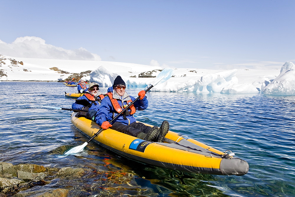 Guests from the Lindblad Expedition ship National Geographic Explorer kayaking in and around the Antarctic Peninsula in the summer months.