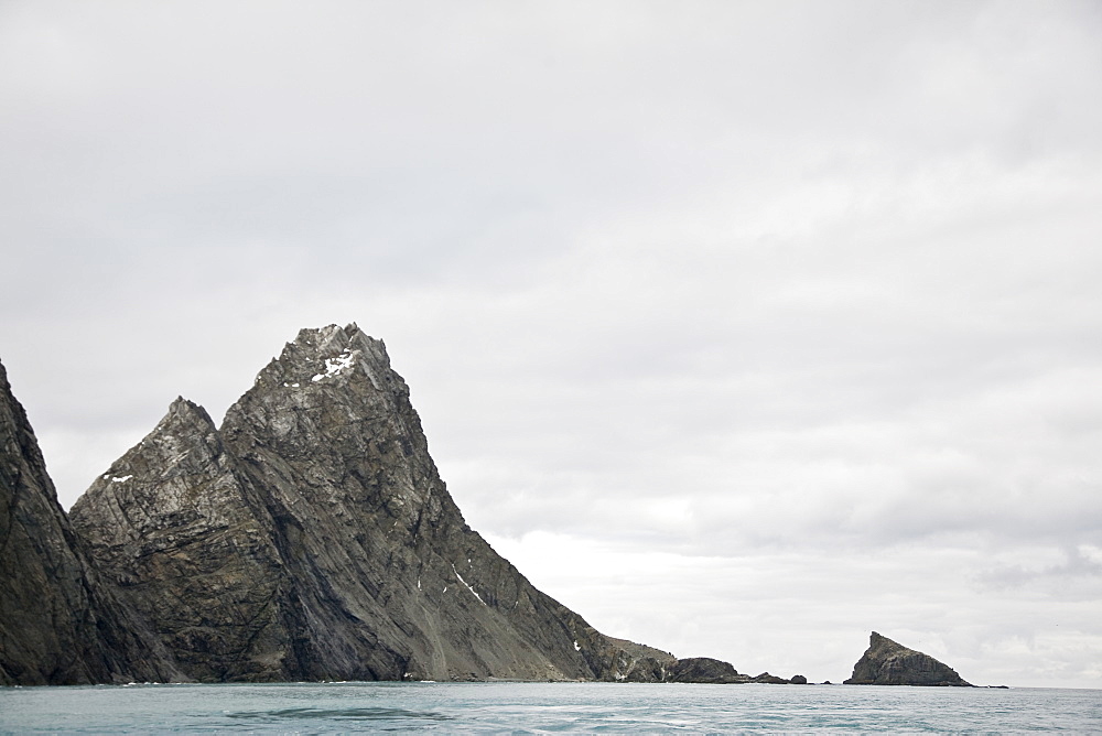 Heavy storm clouds and ice choked waters surround Point Wild on Elephant Island