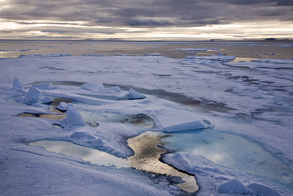 Open leads surrounded by multi-year ice floes in the Barents Sea between EdgeÃ¸ya (Edge Island) and Kong Karls Land in the Svalbard Archipelago, Norway.