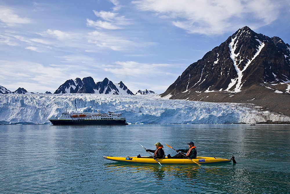 Guests from the Lindblad Expedition ship National Geographic Explorer kayaking near Monaco Glacier on Spitsbergen Island in the Svalbard Archipelago