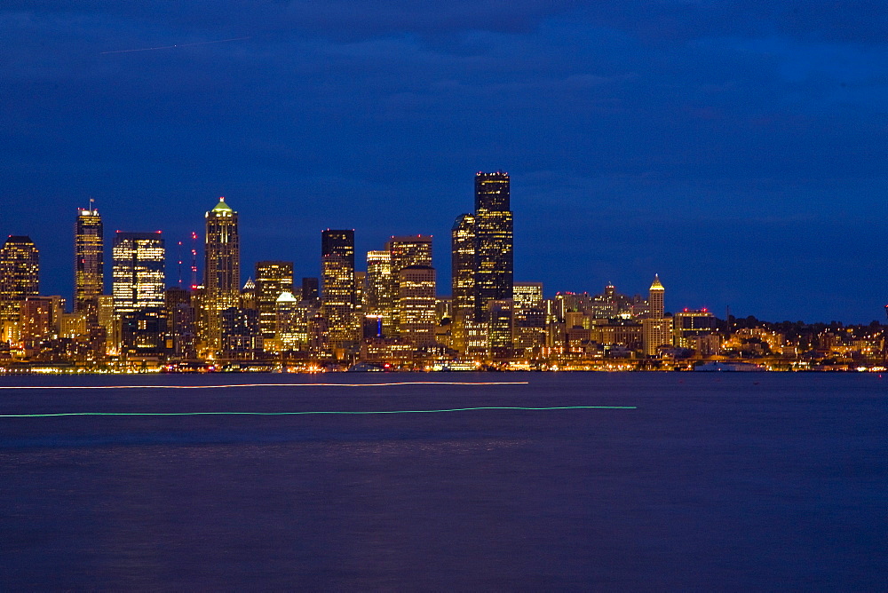 Views at night of downtown Seattle, Washington State, USA. Pacific Ocean.  No model or property releases are available for this image.