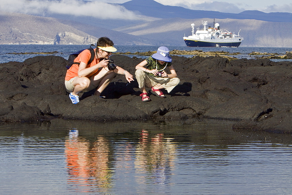 Lindblad Expeditions Guests doing fun and exciting things in the Galapagos Island Archipeligo, Ecuador. Model release number SMB0509.