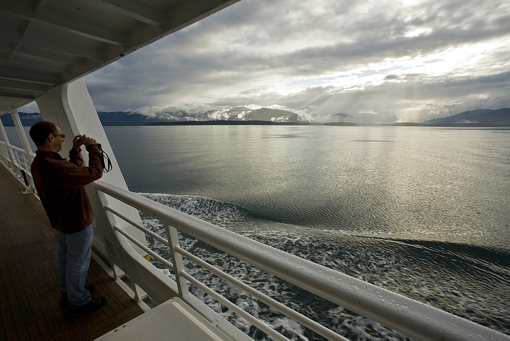 Light rays at sunset in Glacier Bay National Park, Southeast Alaska, USA. Pacific Ocean.