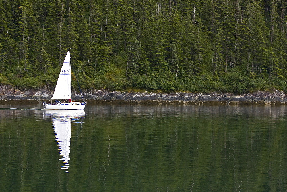 Sailboat underway in Southeast Alaska, USA. Pacific Ocean.