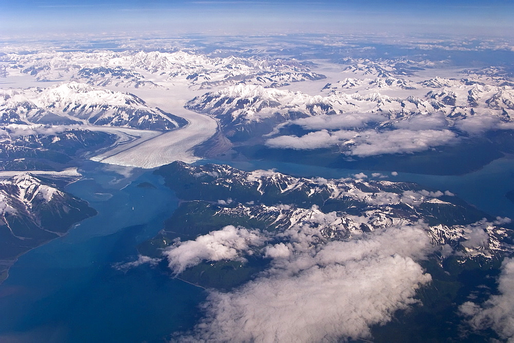 Aerial views of snow-capped mountains, ice fields, and glaciers on a commercial flight from Juneau to Anchorage Alaska, USA, Pacific Ocean