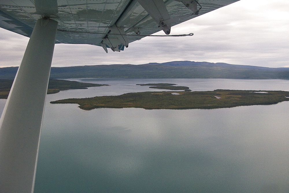 Small float planes being used to shuttle bear watchers between the town of King Salmon and a bear watching lodge at Brooks Camp in Katmai National Park, Alaska, USA. Pacific Ocean.