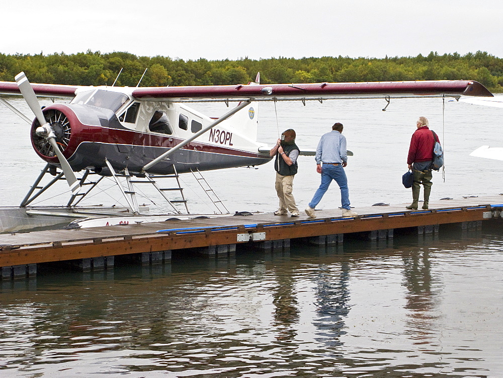 Small float planes being used to shuttle bear watchers between the town of King Salmon and a bear watching lodge at Brooks Camp in Katmai National Park, Alaska, USA. Pacific Ocean.