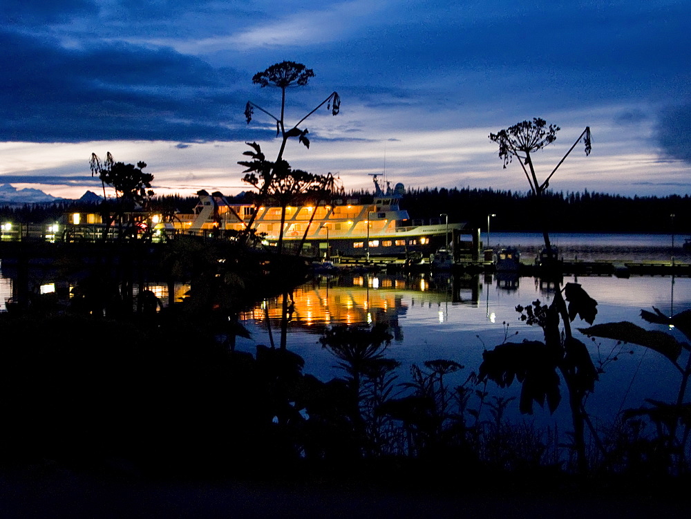 The Lindblad Expeditions ship National Geographic Sea Lion docked at Gustavus in the evening in Southeast Alaska, USA. Pacific Ocean.