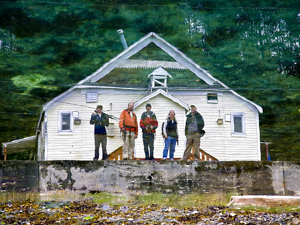 Reflection of Lindblad staff on the ocean's surface in Alert Bay, British Columbia, Canada. No model or property releases for this image.