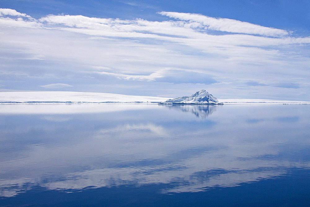 The Lindblad Expeditions ship National Geographic Explorer pushes through ice in Crystal Sound, south of the Antarctic Circle, Antarctica, Southern Ocean
