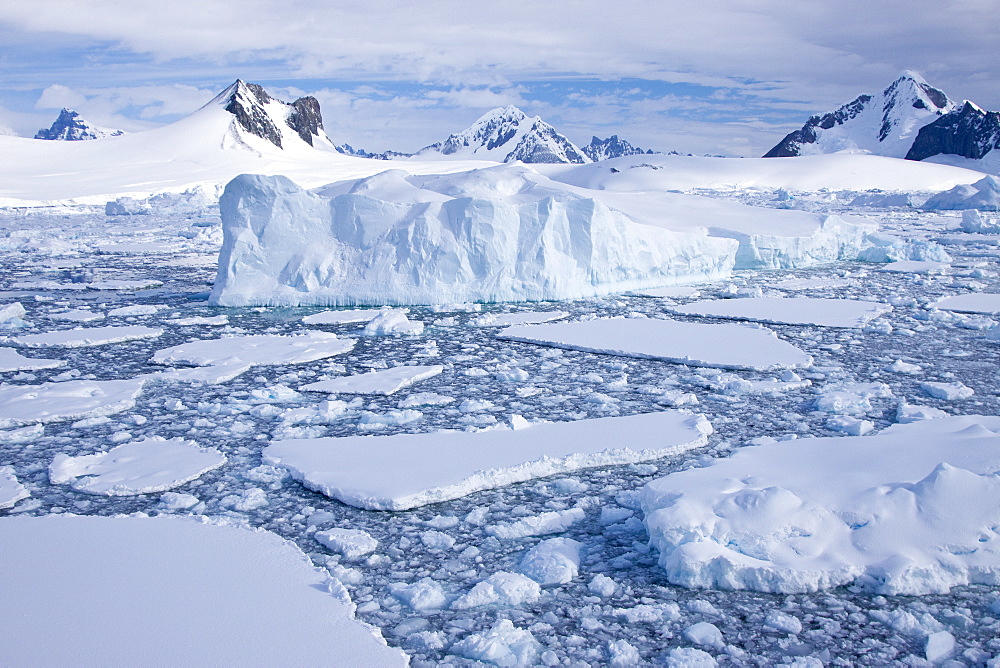 The Lindblad Expeditions ship National Geographic Explorer pushes through ice in Crystal Sound, south of the Antarctic Circle, Antarctica, Southern Ocean