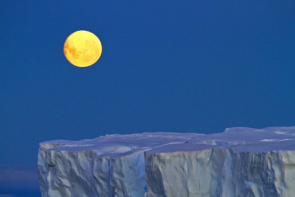 Full moon (plus 1 day) rising over icebergs in the Weddell Sea, Antarctica. MORE INFO This moonrise occurred on January 1, 2010, the night after the blue moon full of December 31, 2009.