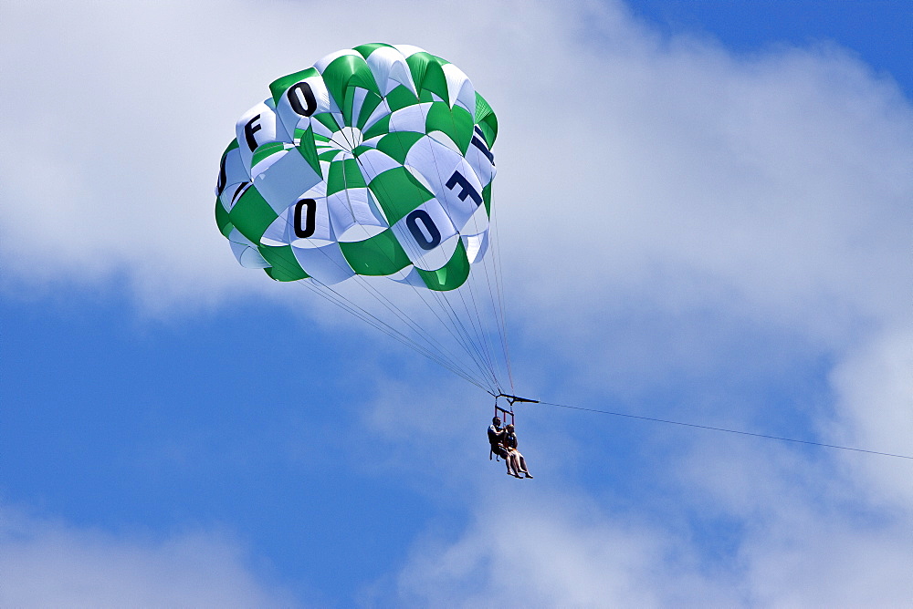 Commercial parasailing operations off the west side of the island of Maui, Hawaii, USA. MORE INFO Parasailing in Hawaii is limited seasonally to times of the year when humpback whales are not present.