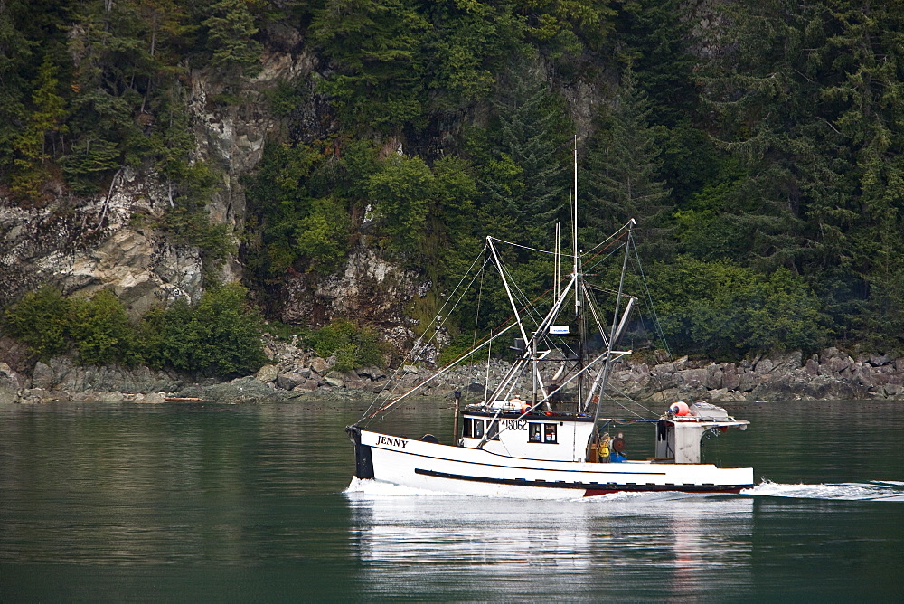 Commercial Alaskan fishing vessel "Jenny" departing Elfin Cove, Southeast Alaska, USA, Pacific Ocean.