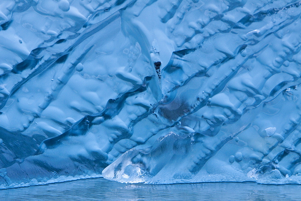 Glacial iceberg detail from ice calved off the Sawyer Glacier in Tracy Arm, Southeast Alaska, USA, Pacific Ocean