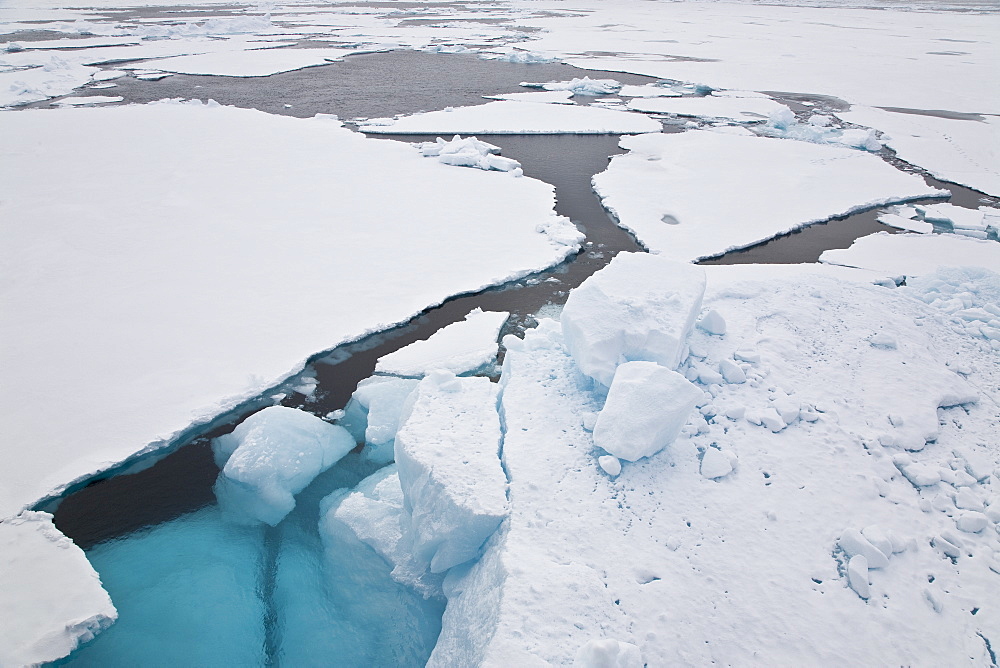 Open leads surrounded by multi-year ice floes in the Barents Sea between EdgeÃ®ya (Edge Island) and Kong Karls Land in the Svalbard Archipelago, Norway.