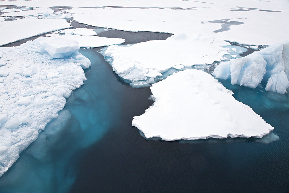 Open leads surrounded by multi-year ice floes in the Barents Sea between EdgeÃ®ya (Edge Island) and Kong Karls Land in the Svalbard Archipelago, Norway.