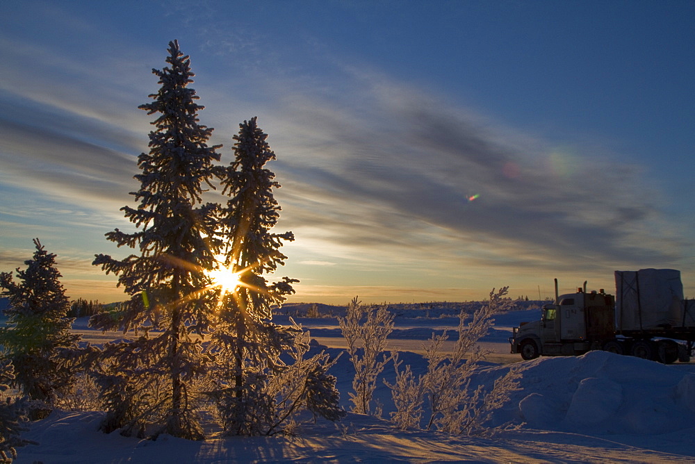 Heavy trucks on the ice road from Tibbitt to Contwoyto beginning just outside of Yellowknife, Northwest Territories, Canada