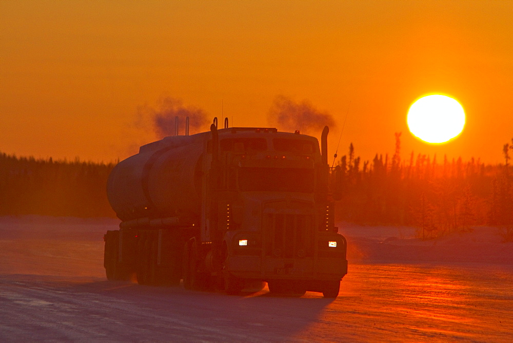 Heavy trucks on the ice road from Tibbitt to Contwoyto beginning just outside of Yellowknife, Northwest Territories, Canada