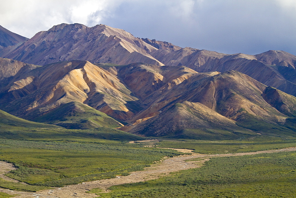 A view of the Polychrome (many-colored) Mountains from a lookout point on the park road inside Denali National Park and Preserve , Alaska, USA.  