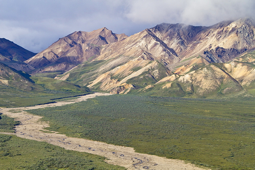 A view of the Polychrome (many-colored) Mountains from a lookout point on the park road inside Denali National Park and Preserve , Alaska, USA.  