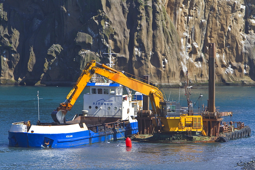 Dredging the harbor on remote Heimaey Island, Iceland