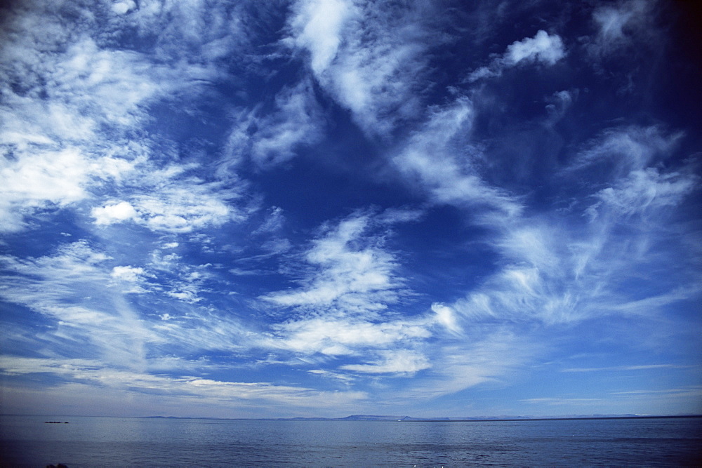 Seascape and cloud formations looking to the west from coast of Iceland.