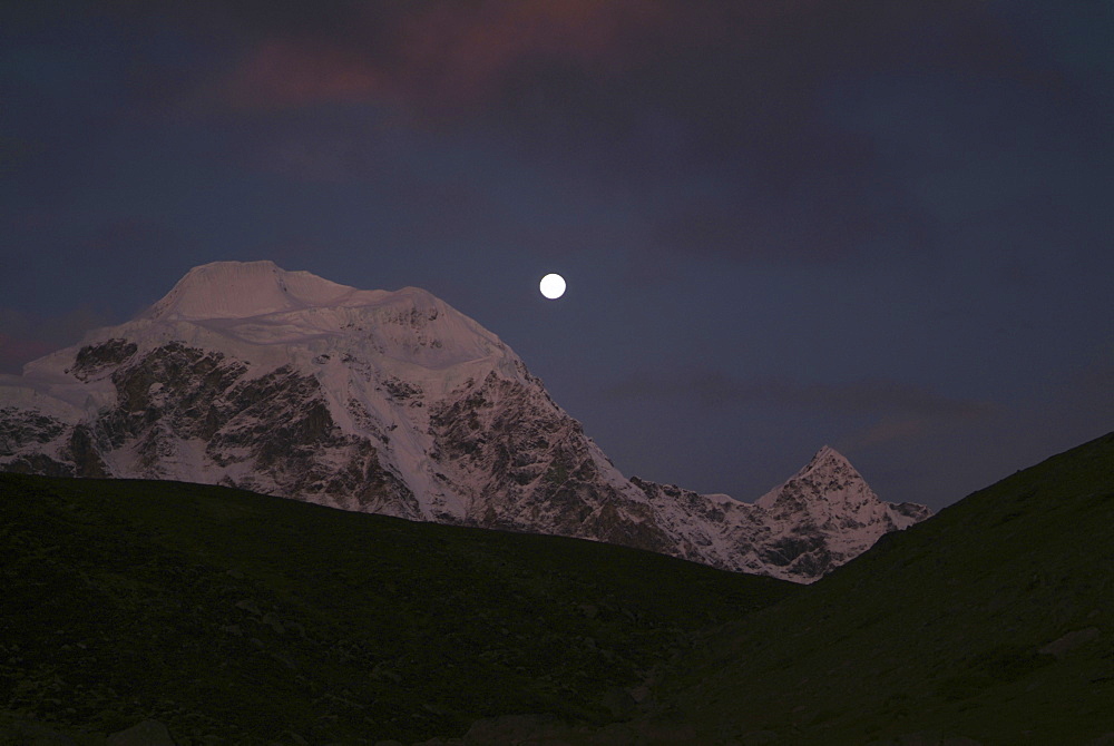 Tibetan  Mountain and Clouds. Moon, Himalayas, Tibet.