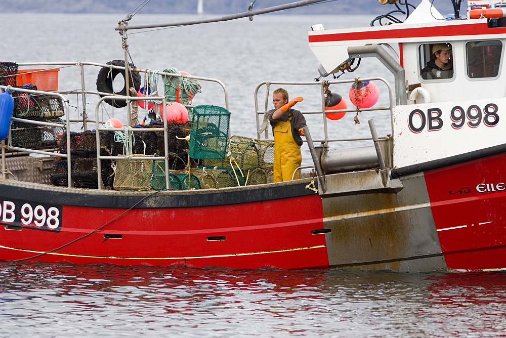 Creel boat.  'Eilean Ban' shooting creels to catch lobster, crab etc.  Hebrides, Scotland