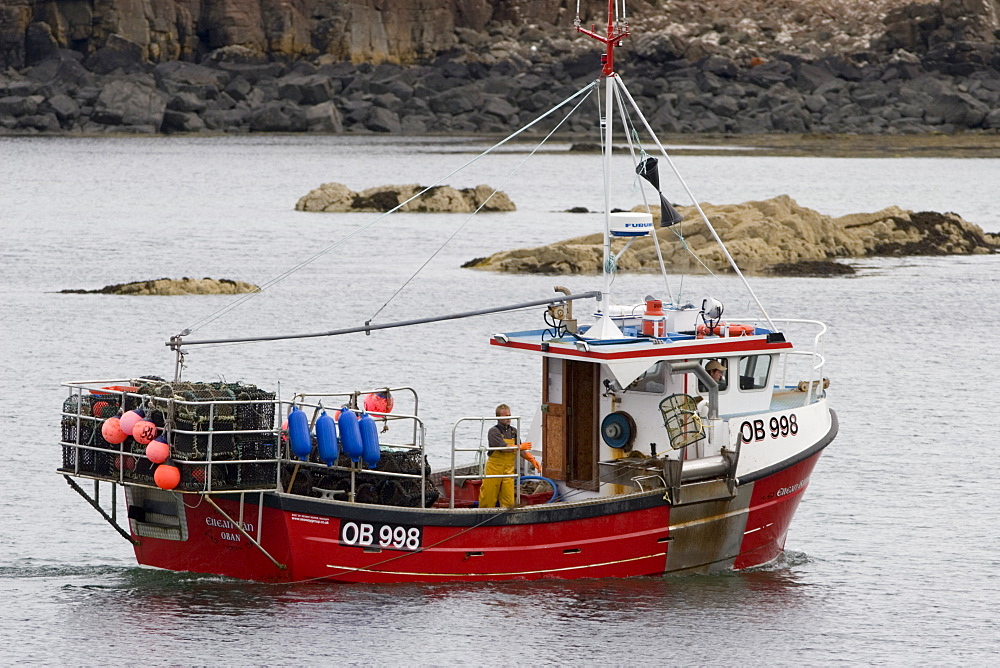 Creel boat.  'Eilean Ban' shooting creels to catch lobster, crab etc.  Hebrides, Scotland