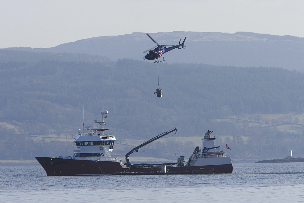 Supplying salmon farm. Hebrides, UK.