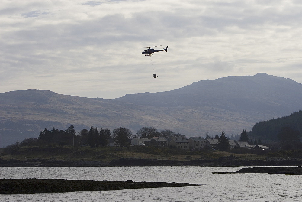 Supplying salmon farm. Hebrides, UK.