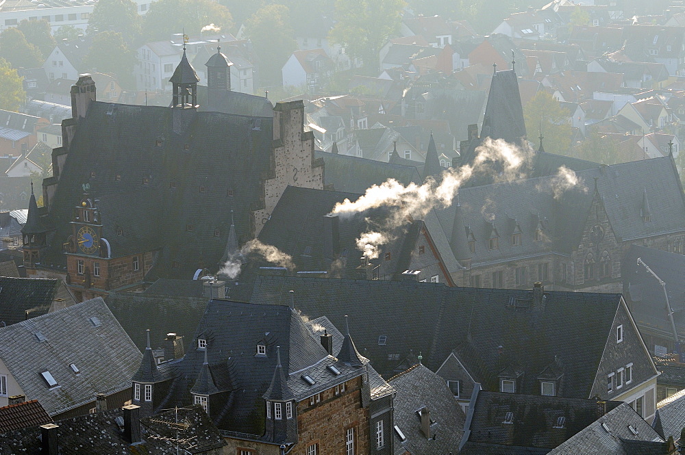 Rooftops of medieval buildings in Marburg, including Town Hall and Old University on a cold, misty autumn morning, Marburg, Hesse, Germany, Europe